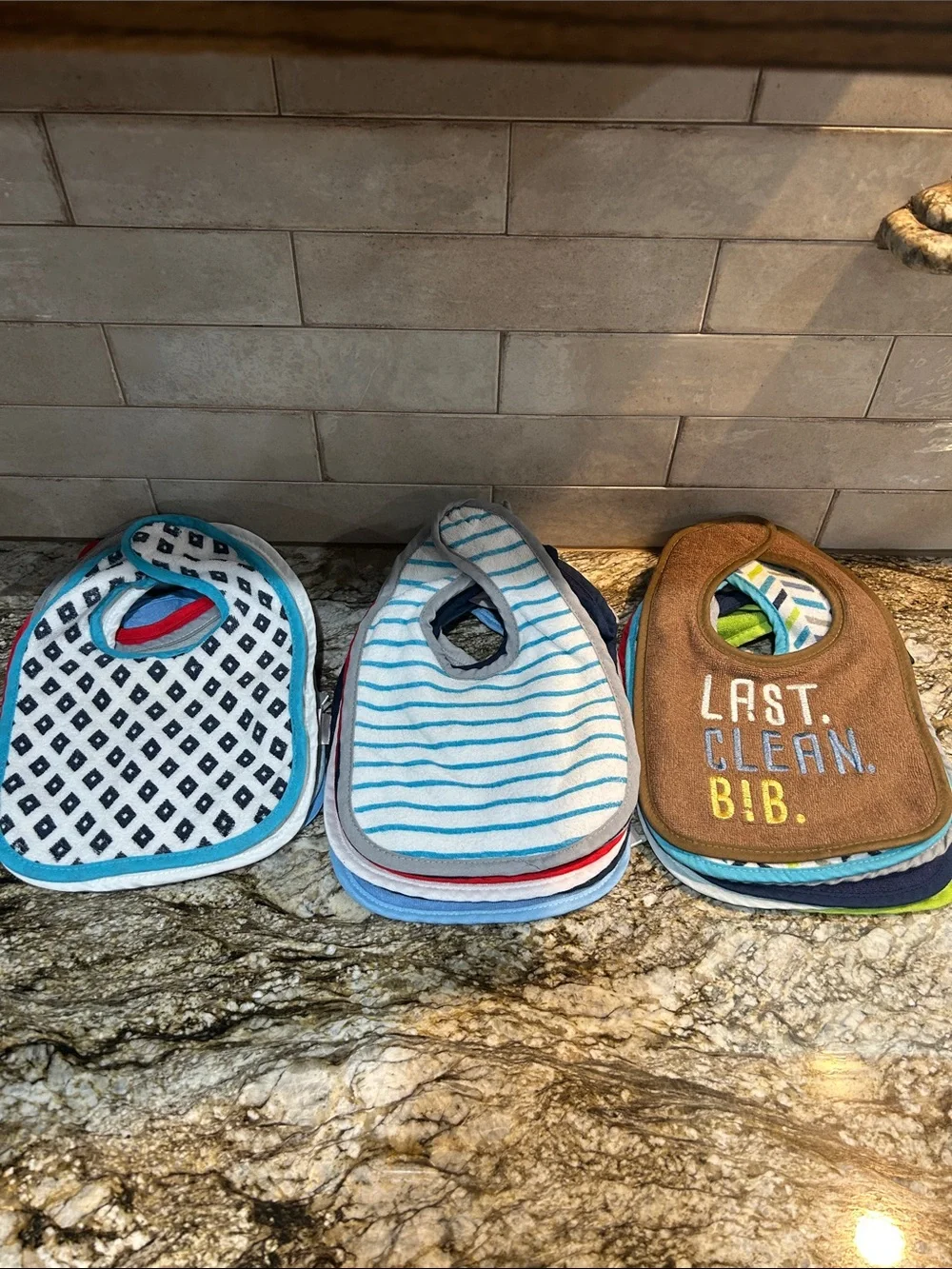 22 clean assortment of bibs.  Kids Blue Striped and Brown 'Last Clean Bib'